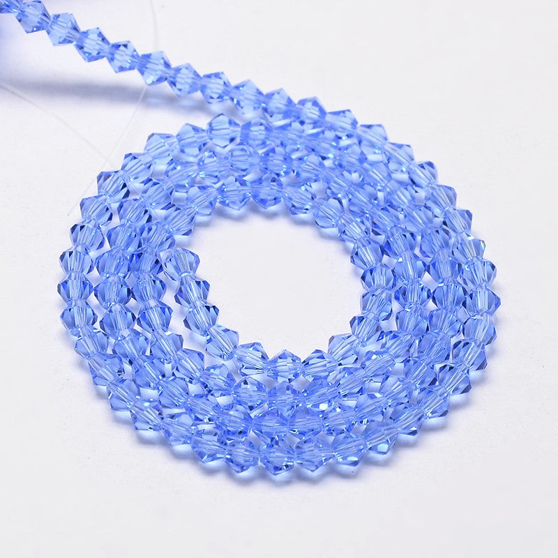חרוזי זכוכית חיתוך יהלום בצבע כחול שקוף 4 מ"מ