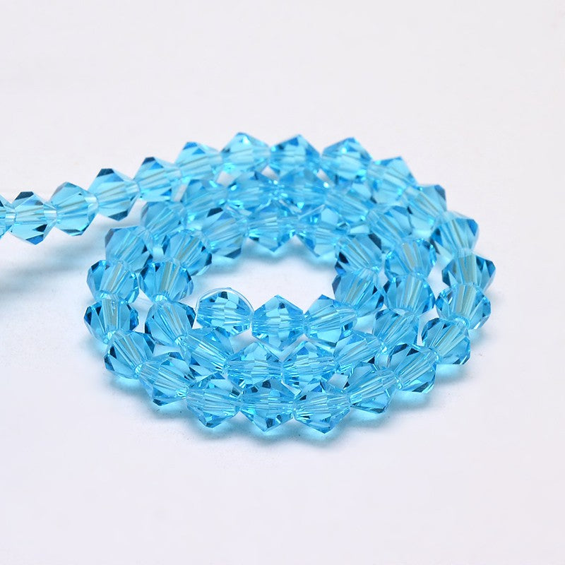 חרוזי זכוכית חיתוך יהלום בצבע כחול טורקיז שקוף 4 מ"מ