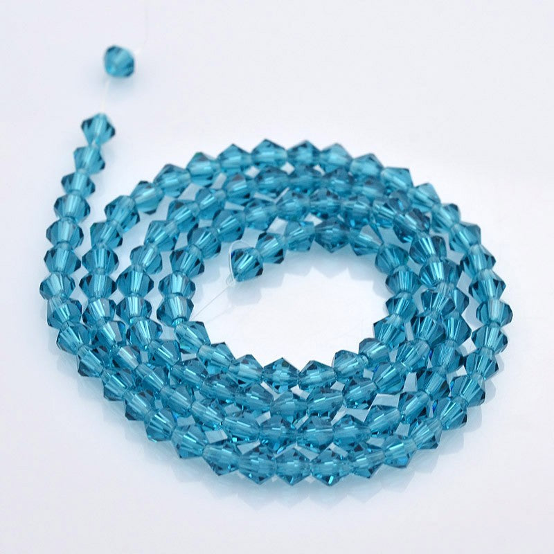 חרוזי זכוכית חיתוך יהלום בצבע כחול שקוף 4 מ"מ
